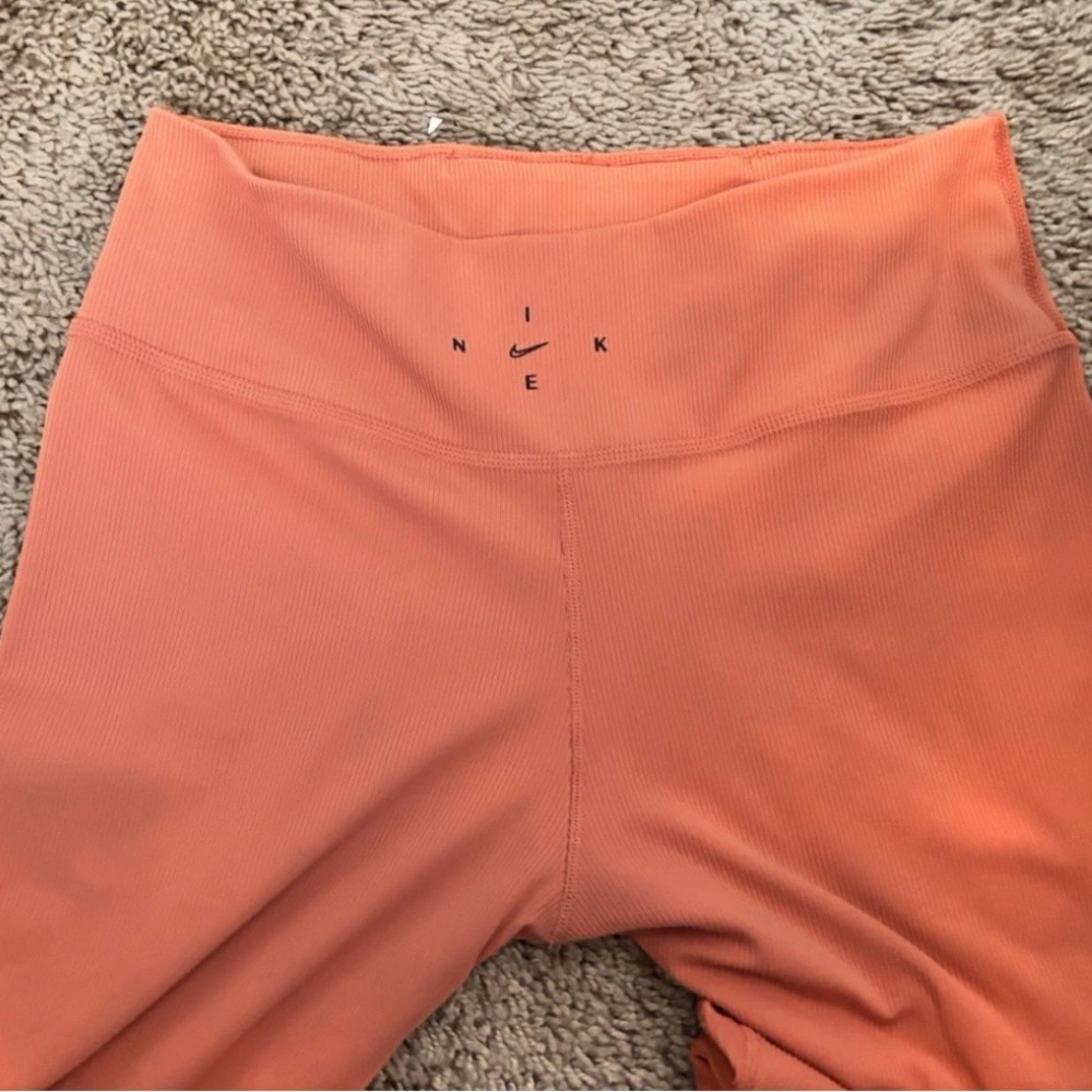 Nike Orange High-Waisted Leggings with Perforated Design